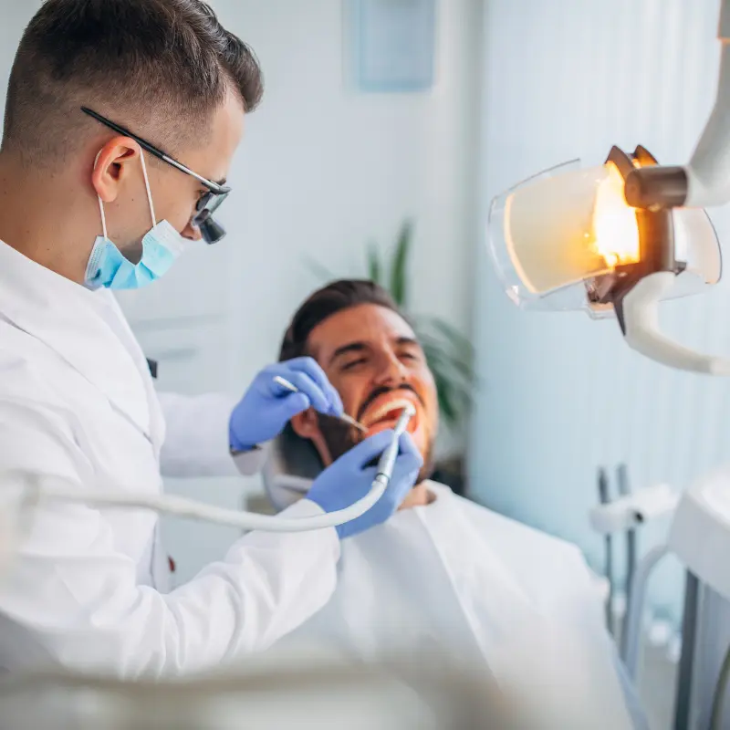 Dentist examining a patient experiencing a dental emergency at Walk in the Park Family Dental in Kitchener